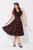 Rozkloszowana sukienka retro vintage w czerwone grochy – kobiecy styl pin up