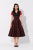 Sukienka rockabilly lata 50 czarna w czerwone grochy – stylizacja vintage z modelką