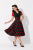 Czarna sukienka pin up lata 50 w czerwone grochy – modelka przód retro vintage